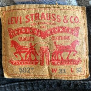 Levi Strauss 502 jeans size 31 W x 32 L black red tag 5- pockets pants EUC